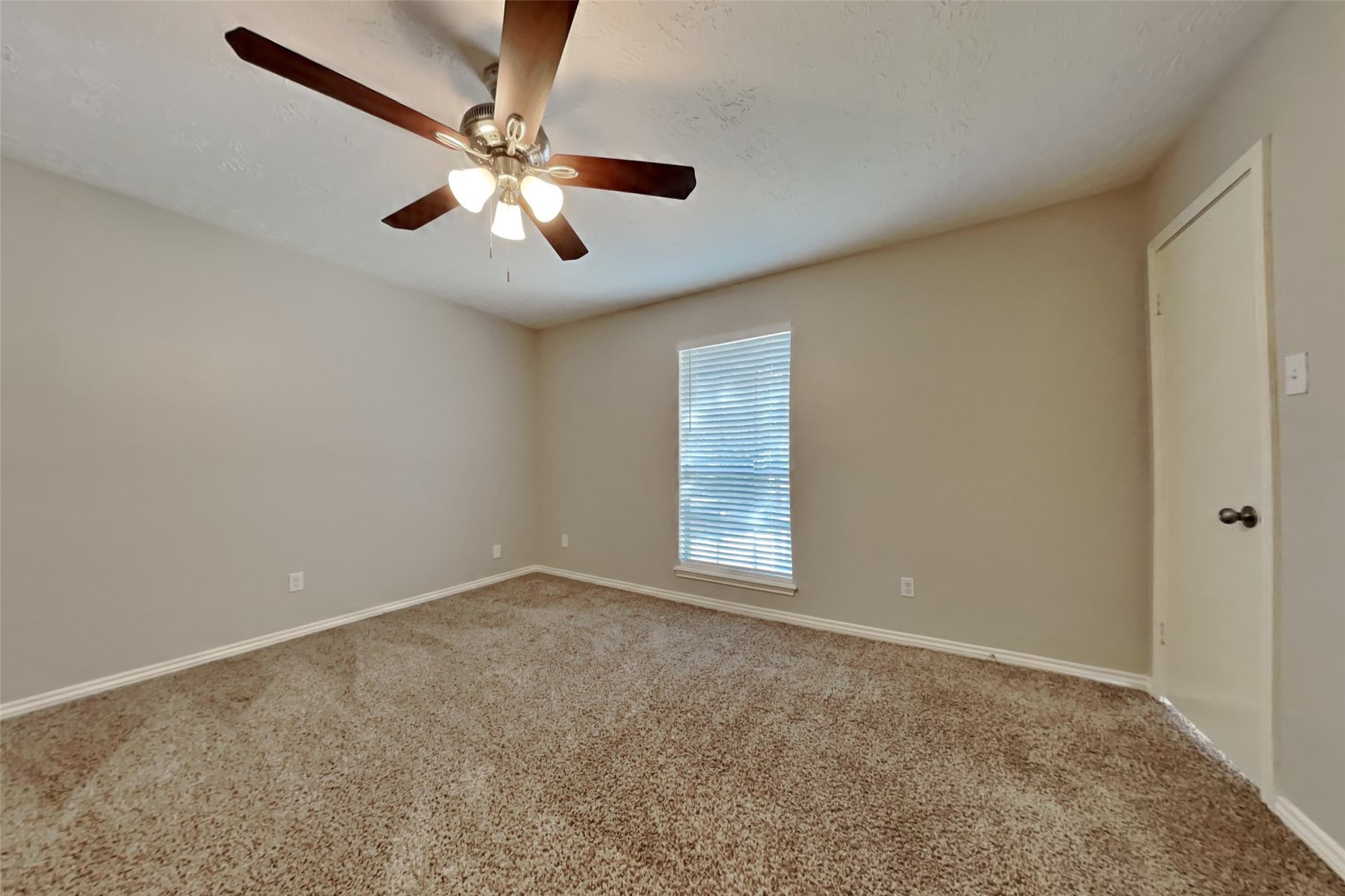 19022 White Candle Drive Spring, TX 77388 - Photo 15 of 22 an empty room with windows and fan