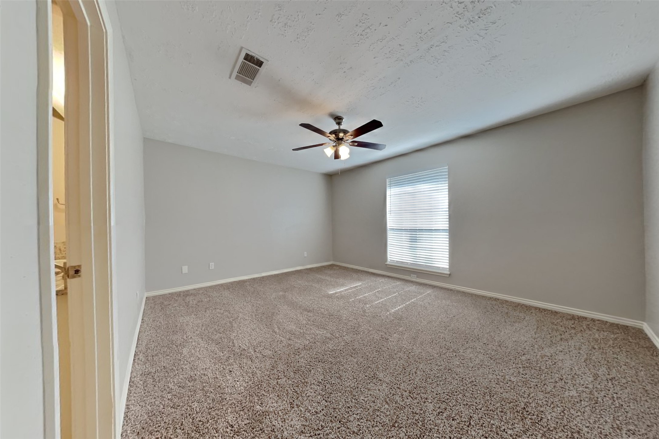 19022 White Candle Drive Spring, TX 77388 - Photo 9 of 22 a view of a livingroom with a ceiling fan and window
