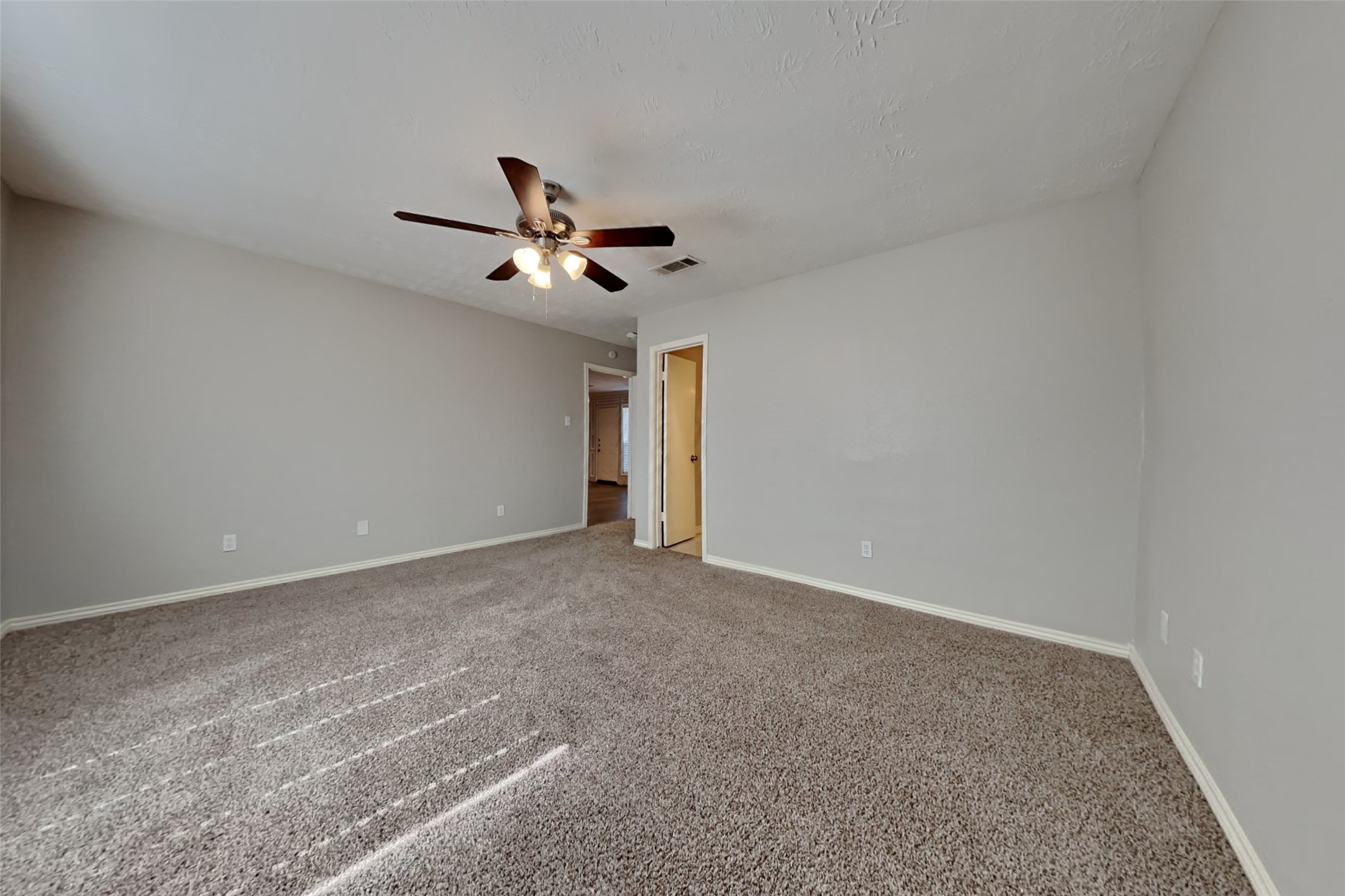 19022 White Candle Drive Spring, TX 77388 - Photo 10 of 22 a view of a livingroom with a ceiling fan