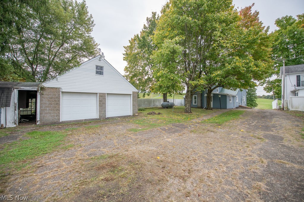 2468 Tabor Ridge Road Northeast New Philadelphia, OH 44663 - Photo 8 of 33 Two-car garage 24 x 24 with upstairs storage and lean-to