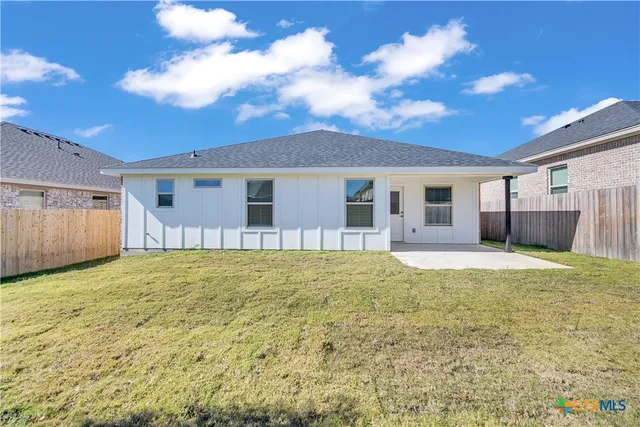 a house view with a backyard space