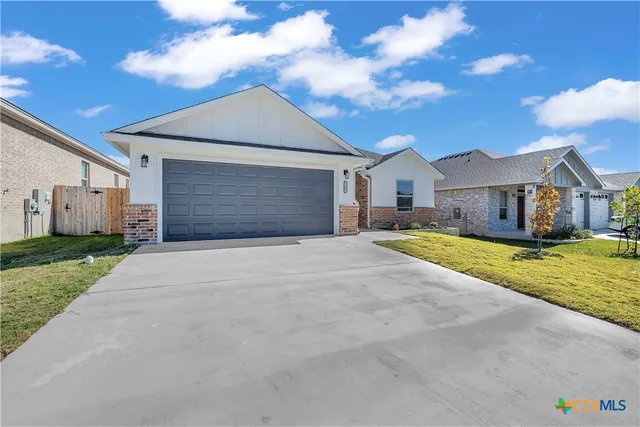 a view of large house with a yard