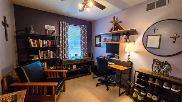a dining room with furniture and wooden floor
