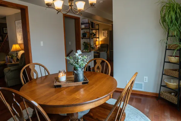 a bedroom with furniture and a flat screen tv