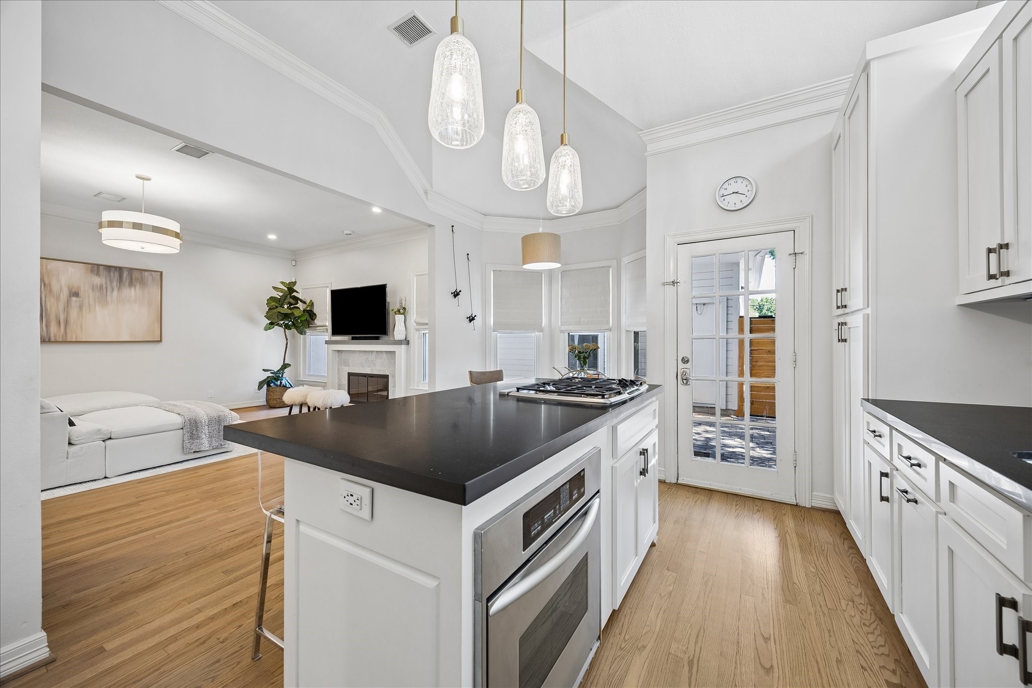 4131 Sunset Boulevard Houston, TX 77005 - Photo 14 of 38 a kitchen with a stove and a chandelier