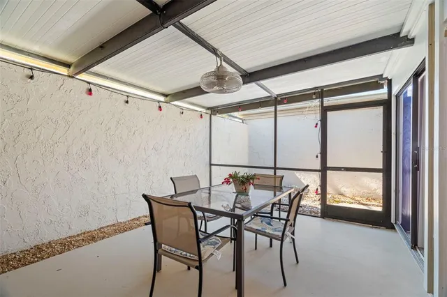 a bathroom with a sink a toilet a mirror and bathtub