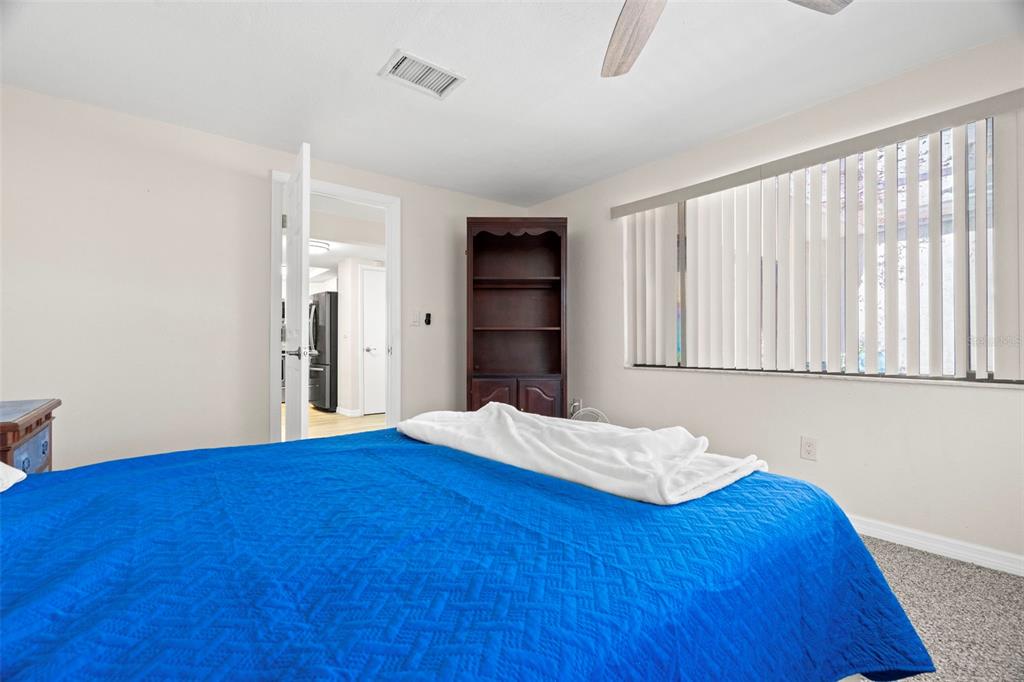 7514 Rocky Point Drive Hudson, FL 34667 - Photo 21 of 38 a bedroom with a bed and a window