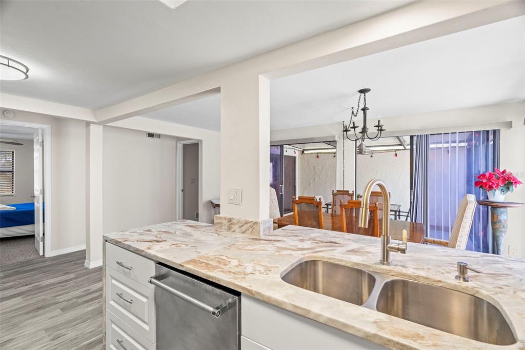 7514 Rocky Point Drive Hudson, FL 34667 - Photo 10 of 38 a kitchen with a sink and a refrigerator