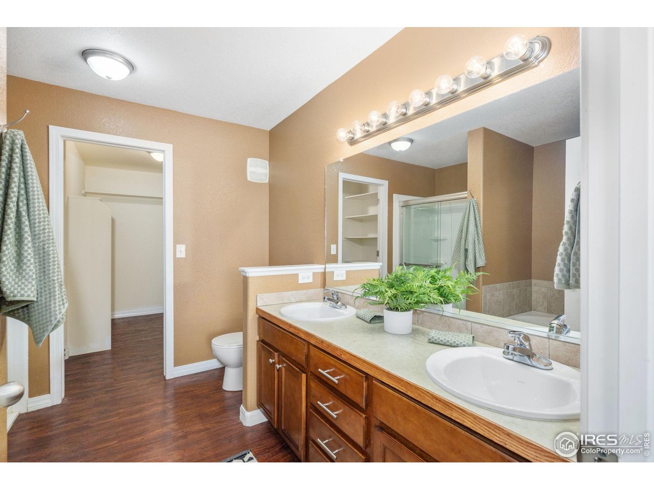 1900 68th Avenue, Unit 4 Greeley, CO 80634 - Photo 17 of 40 a bathroom with a double vanity sink and a mirror