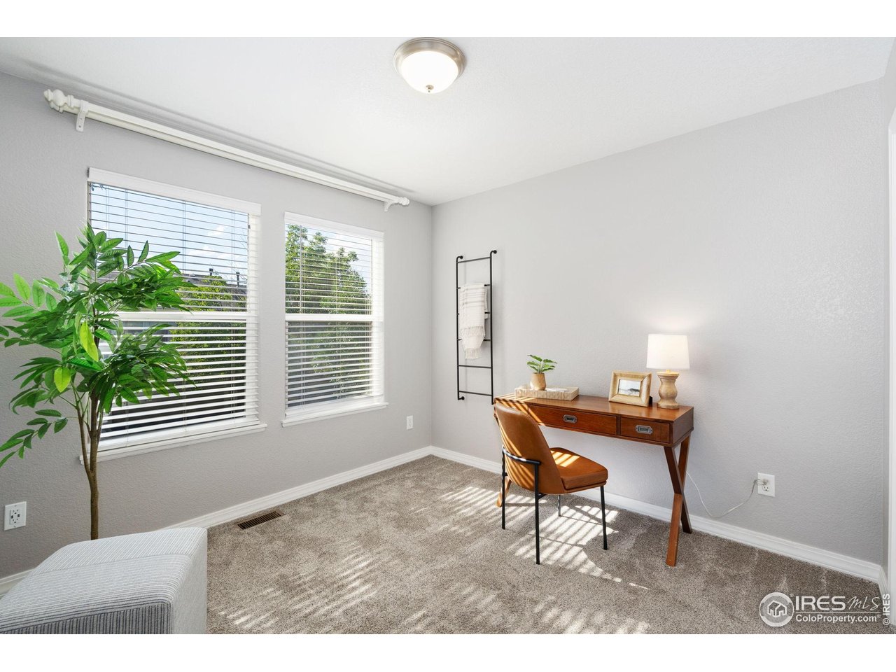 1900 68th Avenue, Unit 4 Greeley, CO 80634 - Photo 23 of 40 a workspace with furniture and a window