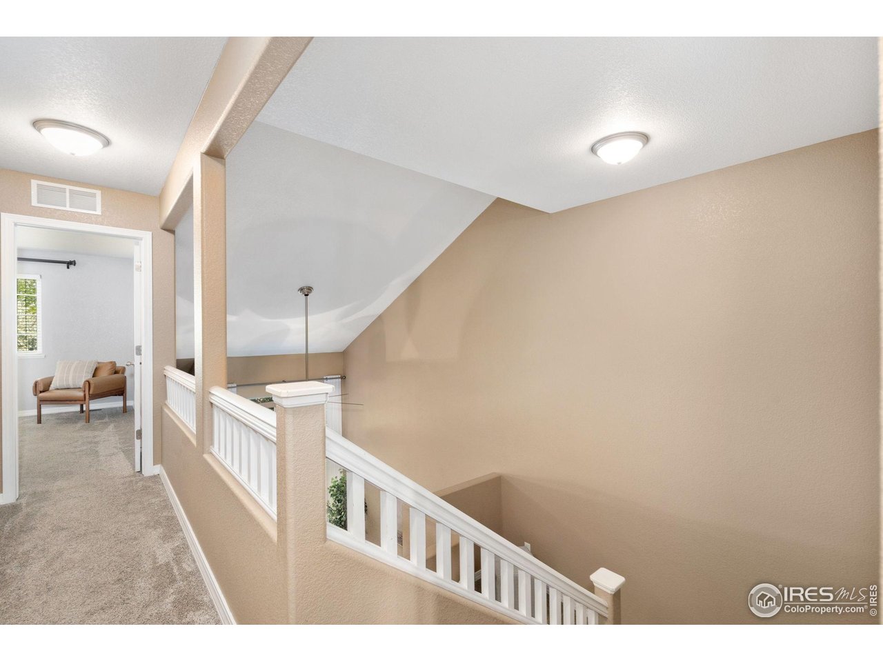 1900 68th Avenue, Unit 4 Greeley, CO 80634 - Photo 27 of 40 a view of hallway with a large window