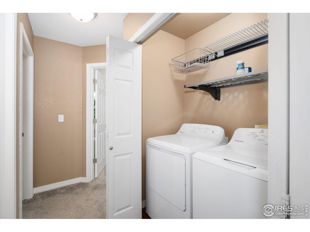 1900 68th Avenue, Unit 4 Greeley, CO 80634 - Photo 28 of 40 a utility room with dryer and washer