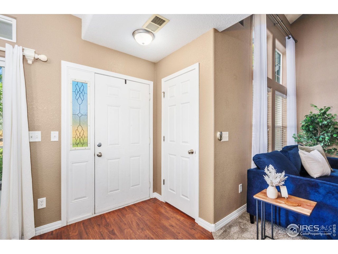 1900 68th Avenue, Unit 4 Greeley, CO 80634 - Photo 3 of 40 a view of room with furniture and wooden floor