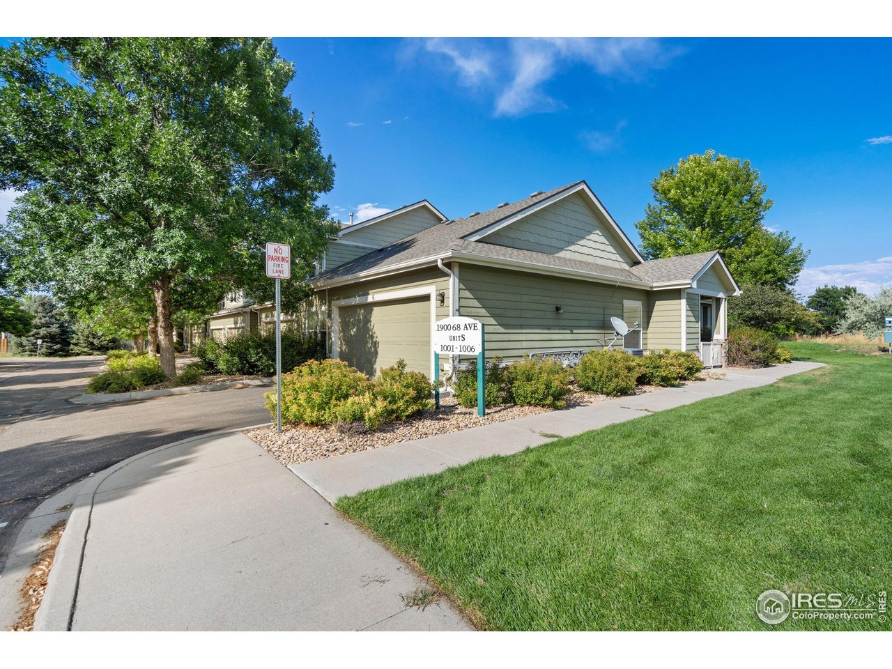 1900 68th Avenue, Unit 4 Greeley, CO 80634 - Photo 31 of 40 a front view of a house with a yard