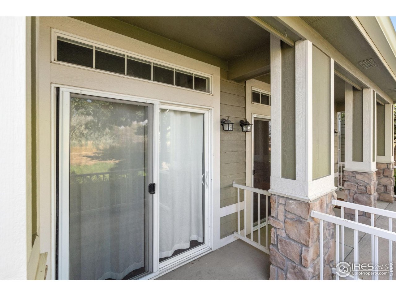 1900 68th Avenue, Unit 4 Greeley, CO 80634 - Photo 37 of 40 a balcony view with a glass door