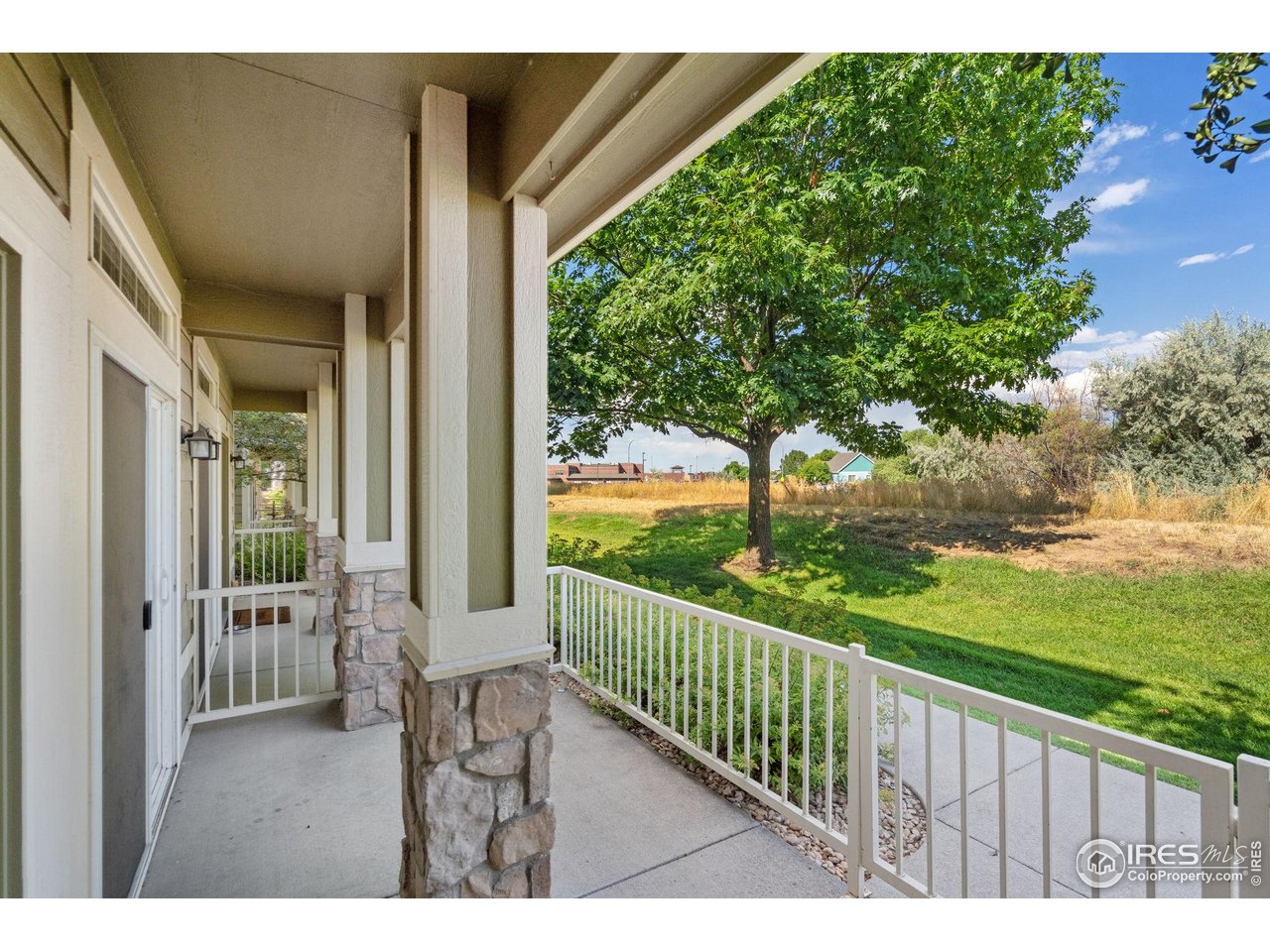 1900 68th Avenue, Unit 4 Greeley, CO 80634 - Photo 38 of 40 a balcony with chairs