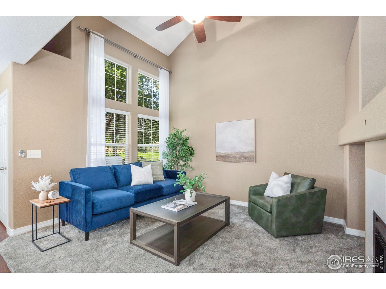 1900 68th Avenue, Unit 4 Greeley, CO 80634 - Photo 4 of 40 a living room with furniture and a potted plant