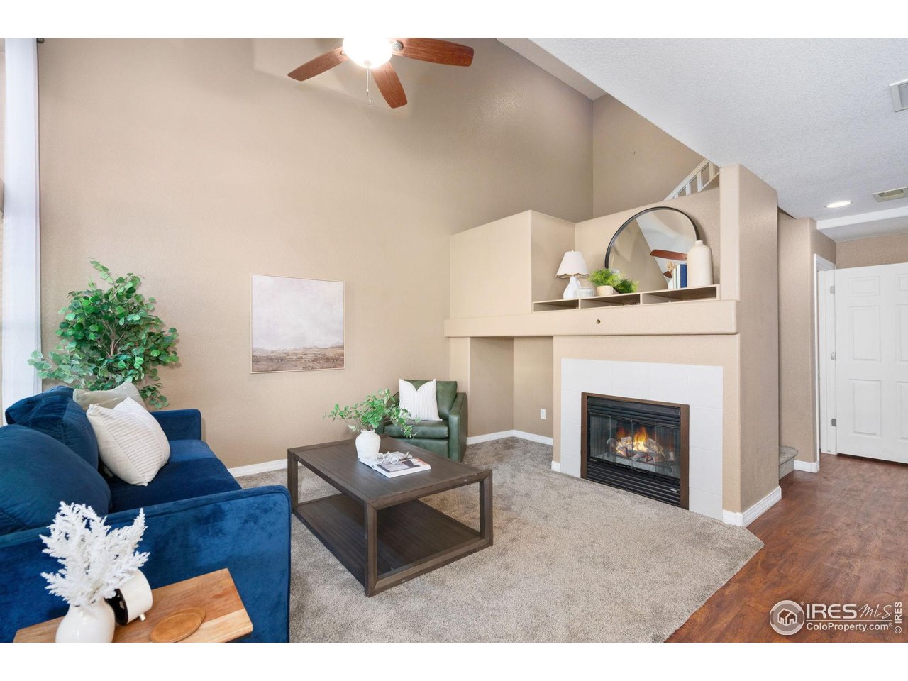 1900 68th Avenue, Unit 4 Greeley, CO 80634 - Photo 5 of 40 a living room with furniture and a fireplace