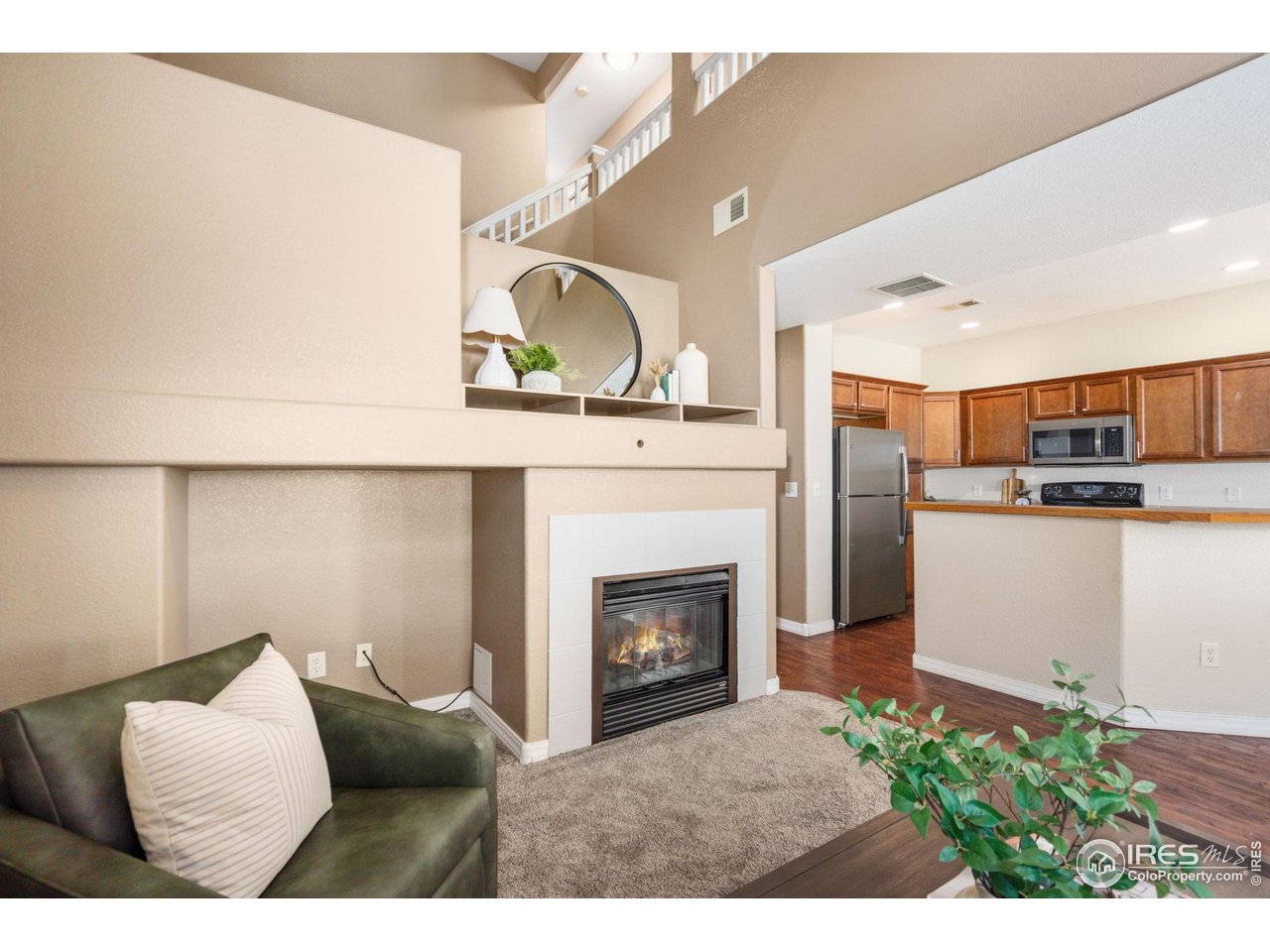 1900 68th Avenue, Unit 4 Greeley, CO 80634 - Photo 6 of 40 a living room with furniture and a fireplace