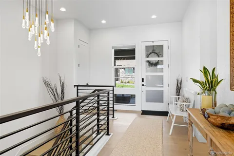 a kitchen with white cabinets and appliances