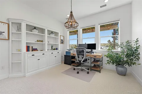 a view of a workspace with furniture