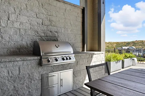 a view of a chairs and table on the terrace