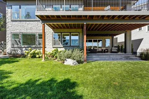 a view of a house with sitting area and garden