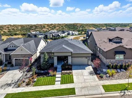 a view of a house with swimming pool and furniture