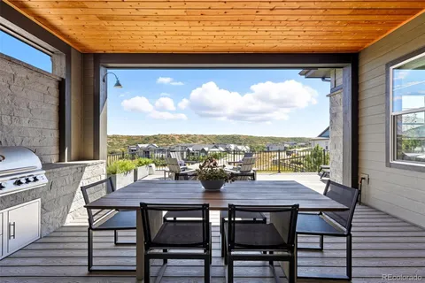 a view of a terrace with furniture and window