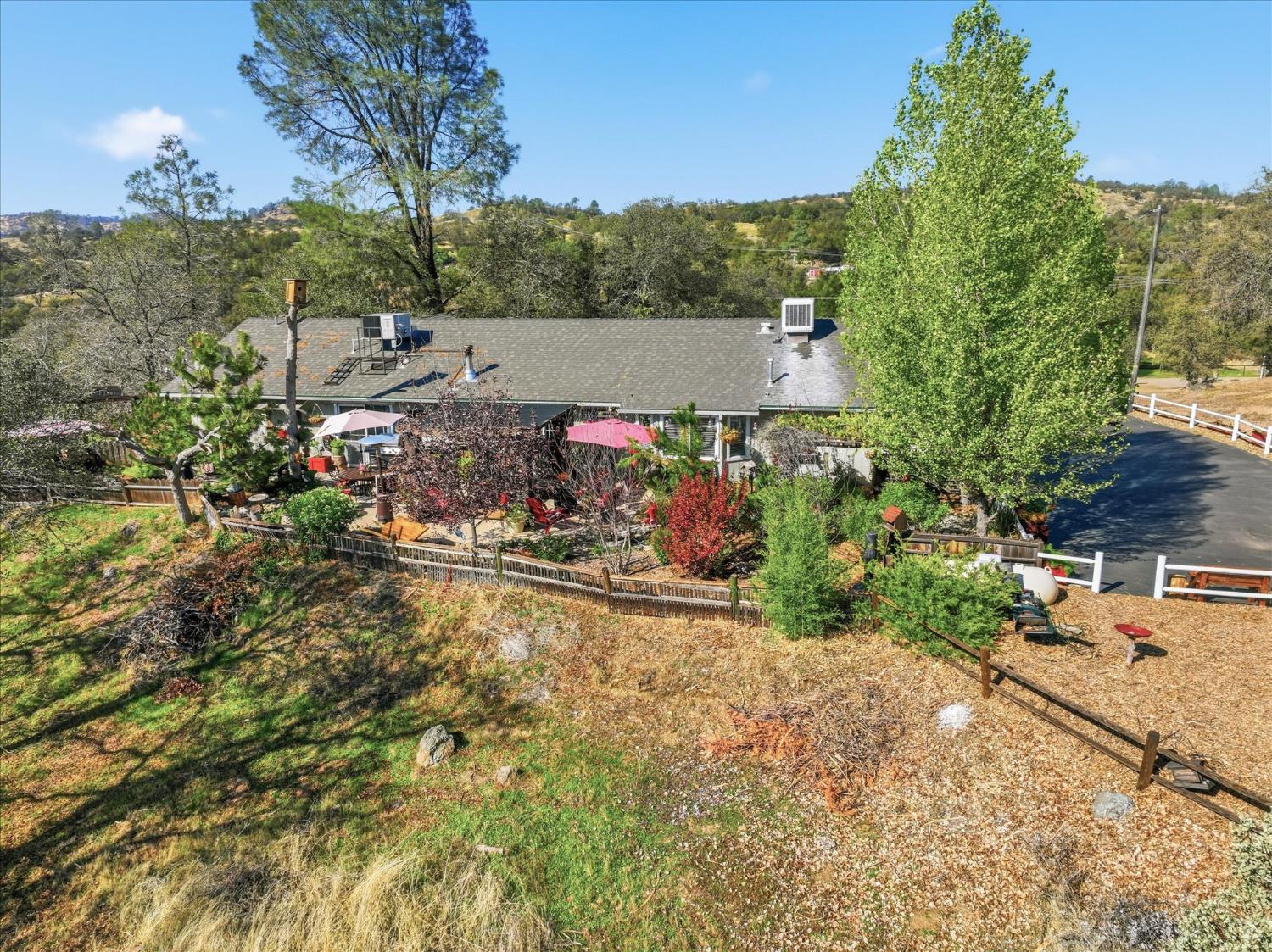 32583 River Knolls Road Coarsegold, CA 93614 - Photo 56 of 63 a view of a houses with a yard and mountain