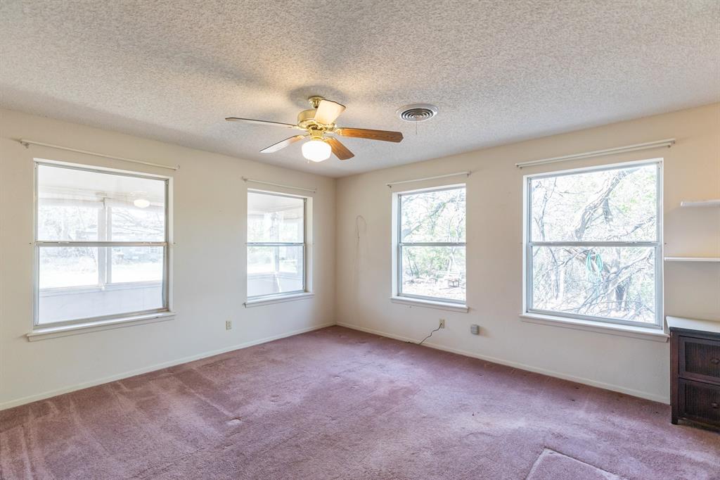 749 Cedar Street Buffalo Gap, TX 79508 - Photo 16 of 30 a view of an empty room with a window