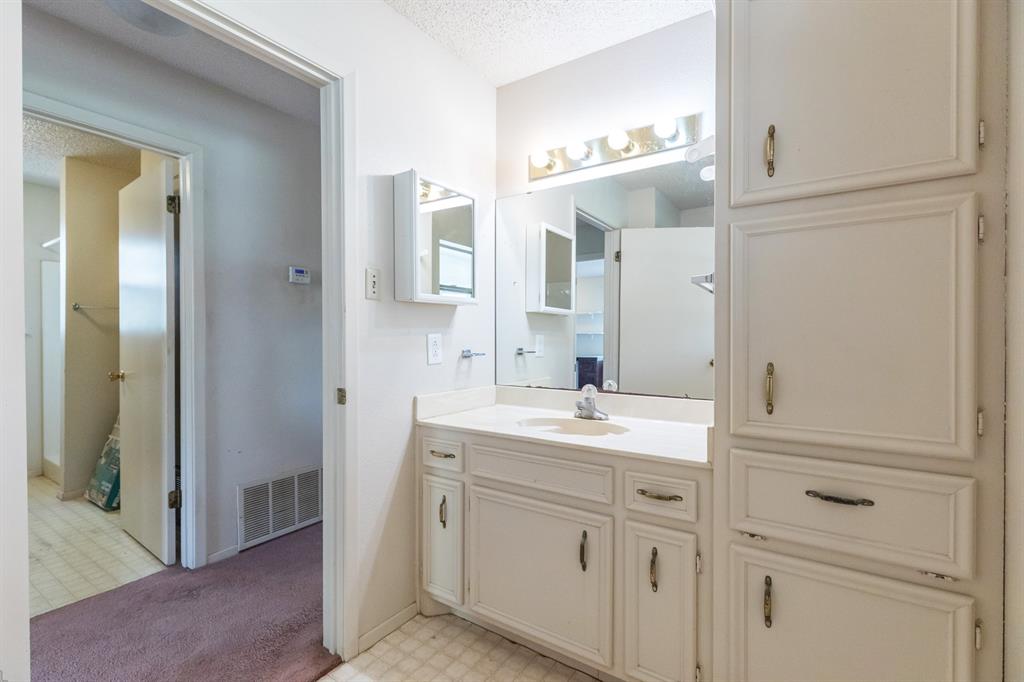 749 Cedar Street Buffalo Gap, TX 79508 - Photo 19 of 30 a spacious bathroom with a double vanity sink mirror and