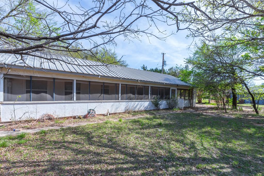 749 Cedar Street Buffalo Gap, TX 79508 - Photo 2 of 30 a front view of a house with a garden