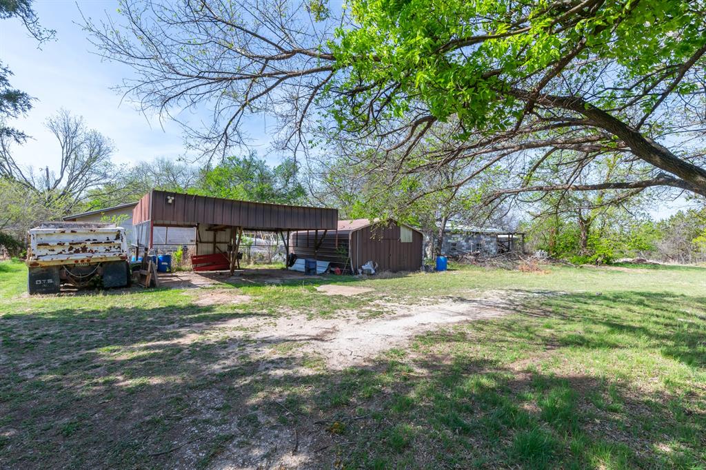 749 Cedar Street Buffalo Gap, TX 79508 - Photo 28 of 30 a view of a house with backyard and a tree