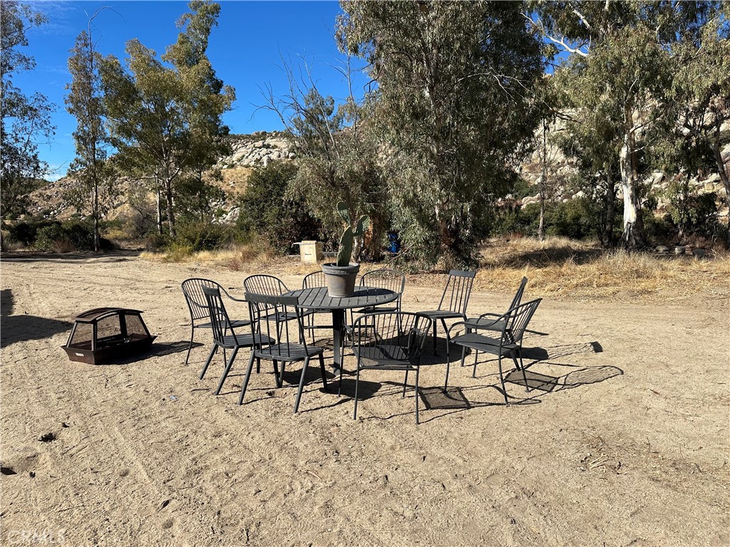 48610 Secret Falls Road Aguanga, CA 92536 - Photo 7 of 10 a view of a chairs and table on the terrace