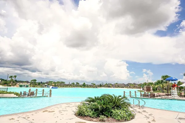 a swimming pool with yard barbeque oven and outdoor seating