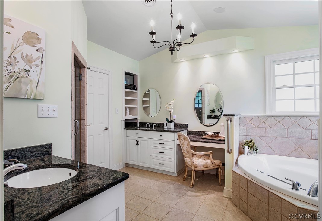 233 Ross Road Henrico, VA 23229 - Photo 21 of 48 a spacious bathroom with a granite countertop sink mirror and bathtub