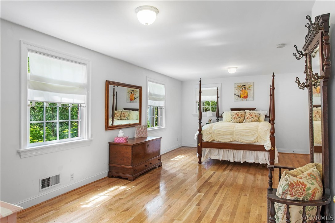 233 Ross Road Henrico, VA 23229 - Photo 27 of 48 a bedroom with a bed and wooden floor