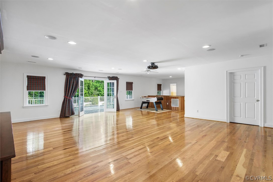 233 Ross Road Henrico, VA 23229 - Photo 35 of 48 a view of empty room with wooden floor and floor to ceiling window