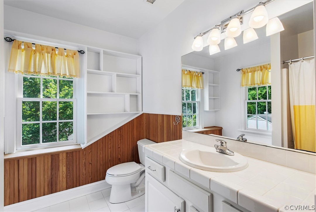 233 Ross Road Henrico, VA 23229 - Photo 40 of 48 a bathroom with a sink a toilet and a window