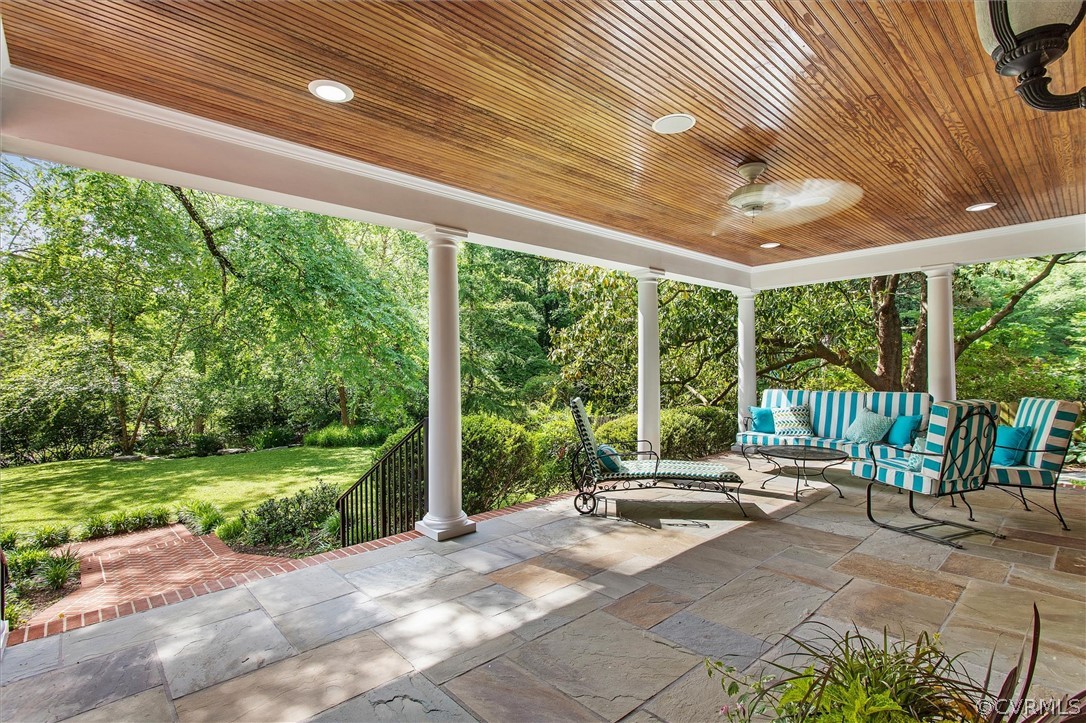 233 Ross Road Henrico, VA 23229 - Photo 4 of 48 a view of a patio with a table chairs and a floor to ceiling window