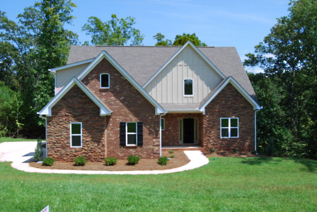 118 Laurel Ridge Forsyth, GA 31029 - Photo 1 of 21 a front view of a house with a yard