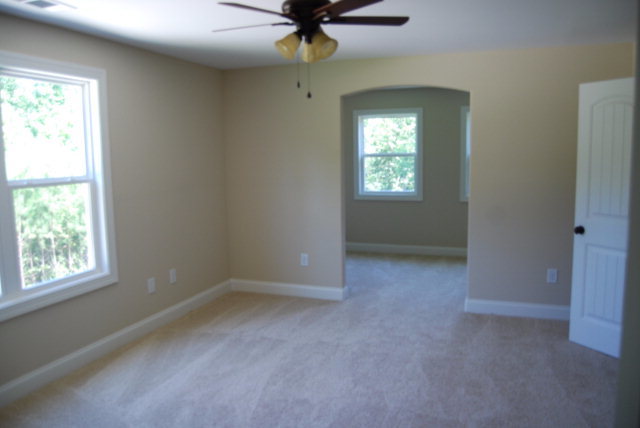 118 Laurel Ridge Forsyth, GA 31029 - Photo 13 of 21 an empty room with a window and a chandelier fan