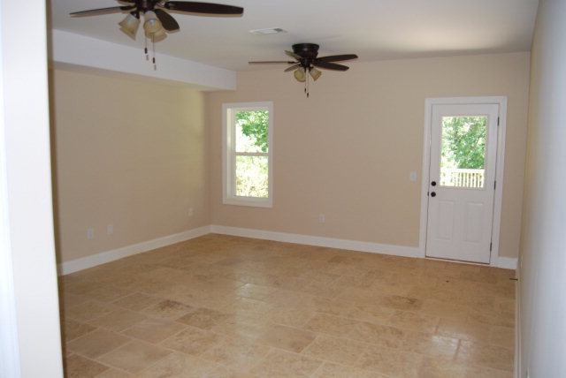 118 Laurel Ridge Forsyth, GA 31029 - Photo 20 of 21 an empty room with windows and fan