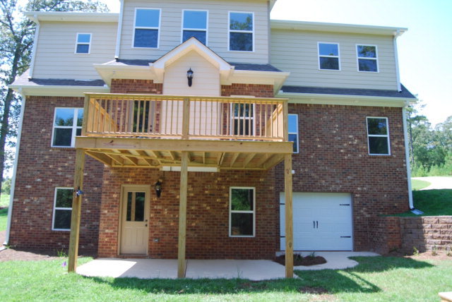 118 Laurel Ridge Forsyth, GA 31029 - Photo 4 of 21 a view of a brick house with a yard