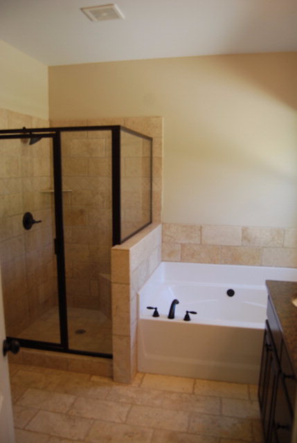 118 Laurel Ridge Forsyth, GA 31029 - Photo 9 of 21 a bathroom with a tub and a shower