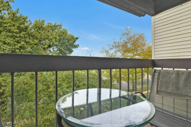 a view of a balcony with furniture