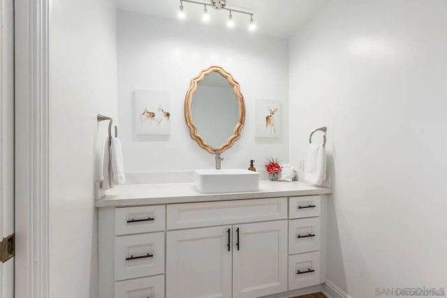 a bedroom with a large bed and a large window