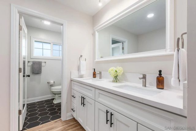 a spacious bedroom with a bed and a large window