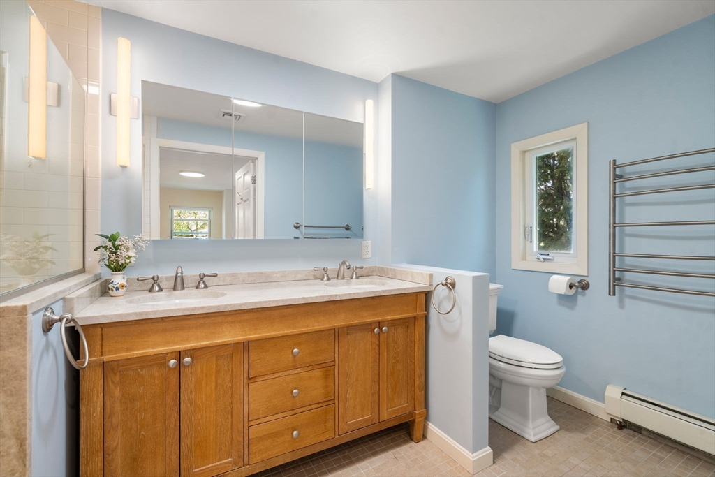 50 Mary Ellen Road Newton, MA 02468 - Photo 11 of 22 a bathroom with a sink toilet vanity and mirror